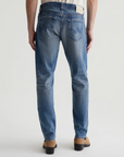 model wearing ag jeans tells modern slim jean in 16 years clifton blue, shown from the rear