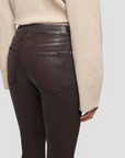 rear pocket close up view of 7 for all mankind's high waist slim kick coated pant in chocolate brown