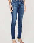 model wearing ag jeans prima mid rise slim jean in brighton blue, shown from the waist down