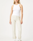 model wearing the white jersey tank from mavi jeans, paired with beige pants and sneakers