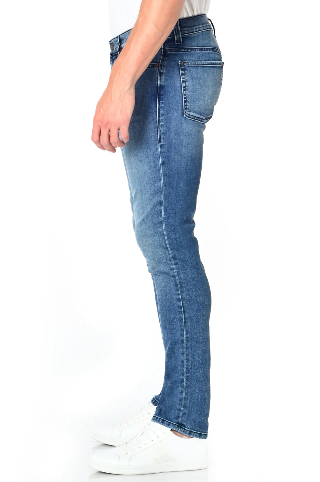 model wearing fidelity denim torino slim fit jean in tower blue, shown from the side