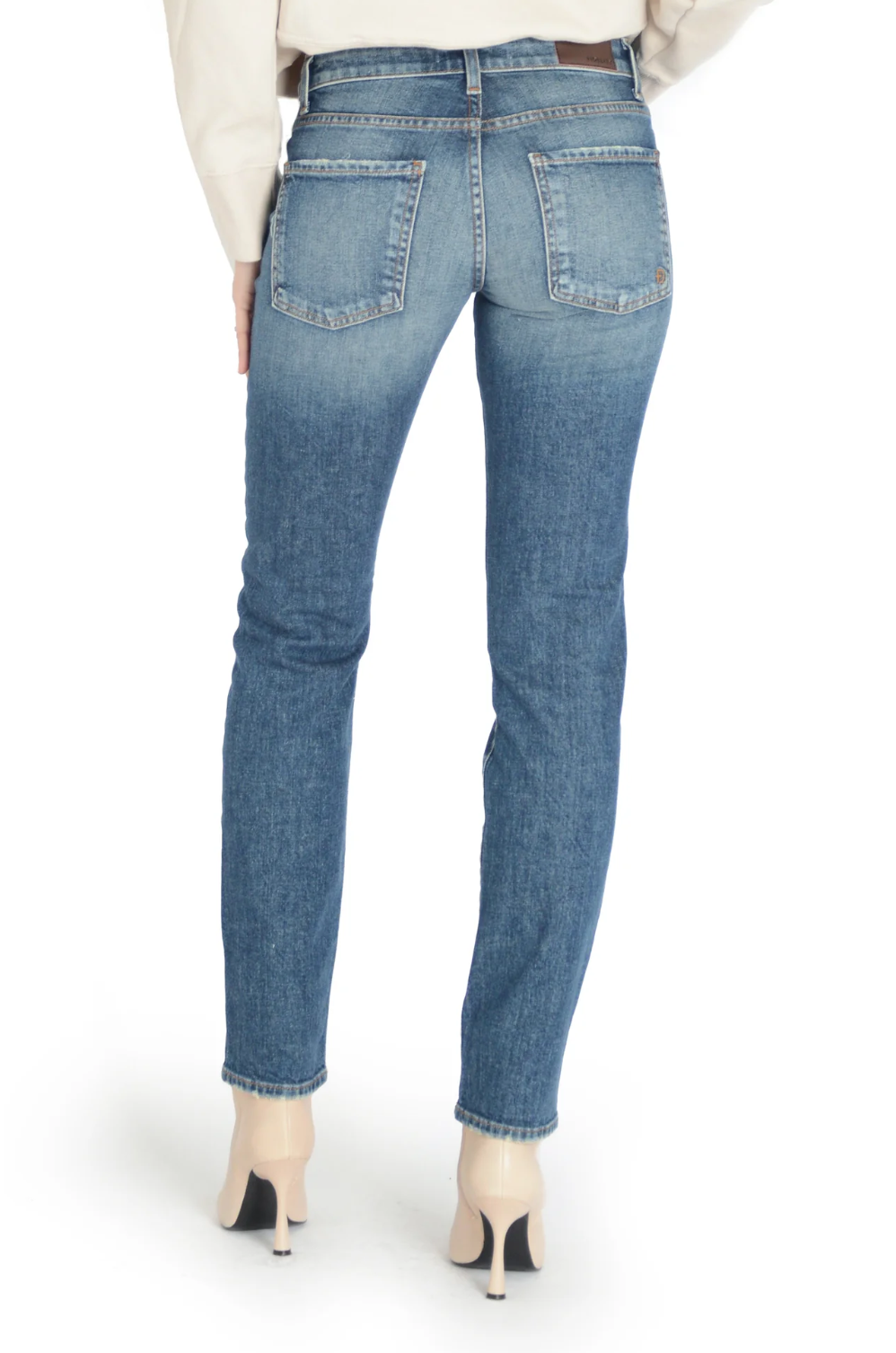 model wearing fidelity denim axl girlfriend fit jean in cortez blue, shown from the rear