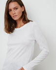 model wearing liz city slub crew neck long sleeve tee in white from Velvet, standing at an angle
