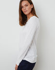 model wearing liz city slub crew neck long sleeve tee in white from Velvet, standing sideways