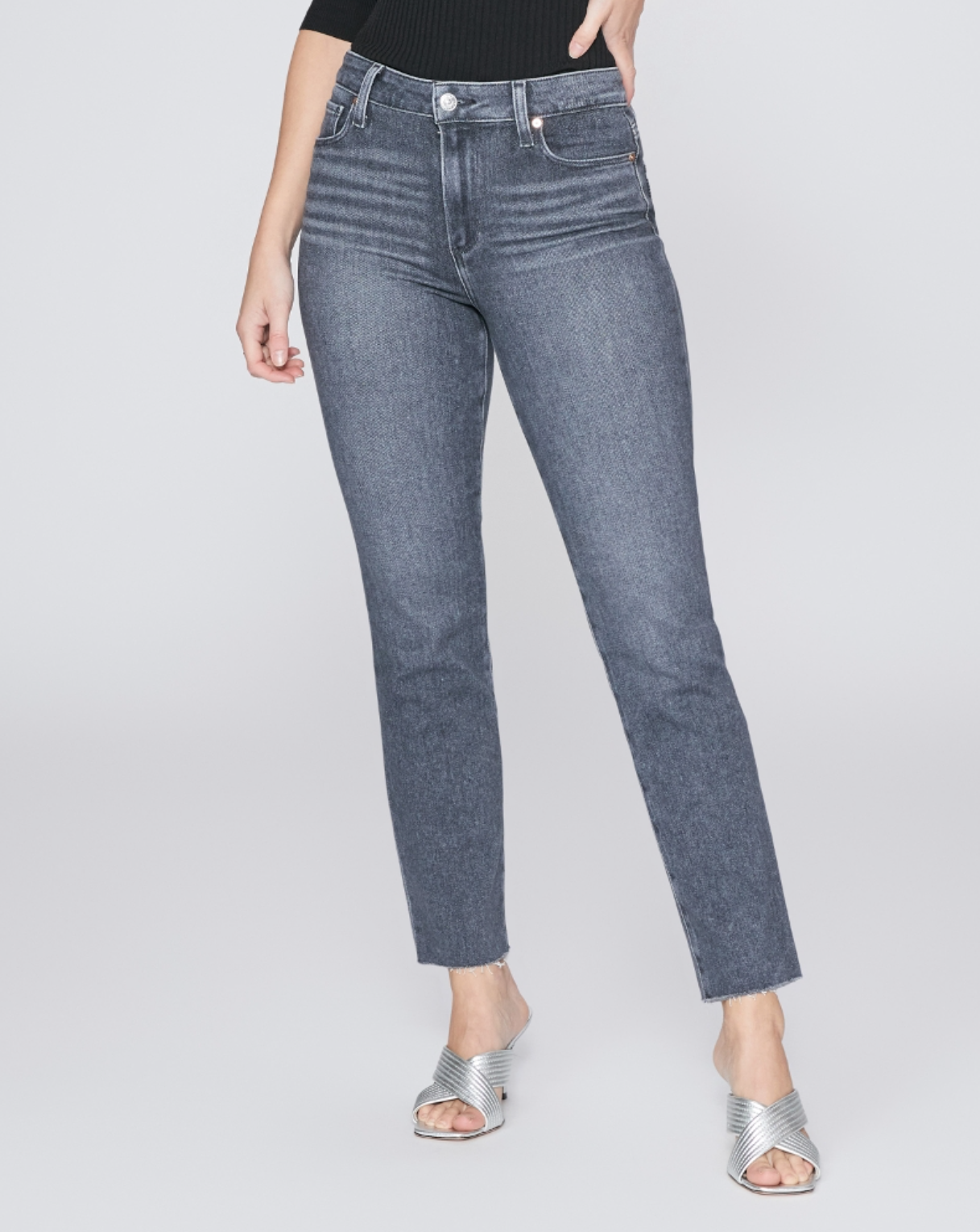 waist down front view of the cindy jean with raw hem from paige in grey