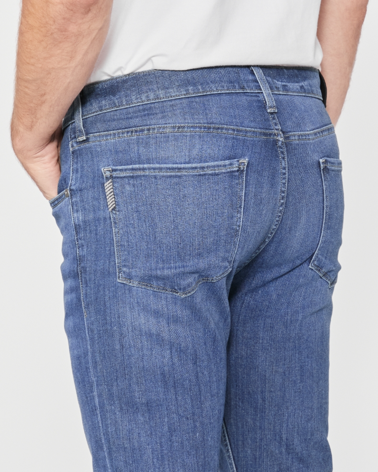 close up rear view of the federal slim straight jean from paige in redding blue, showing pocket detail 