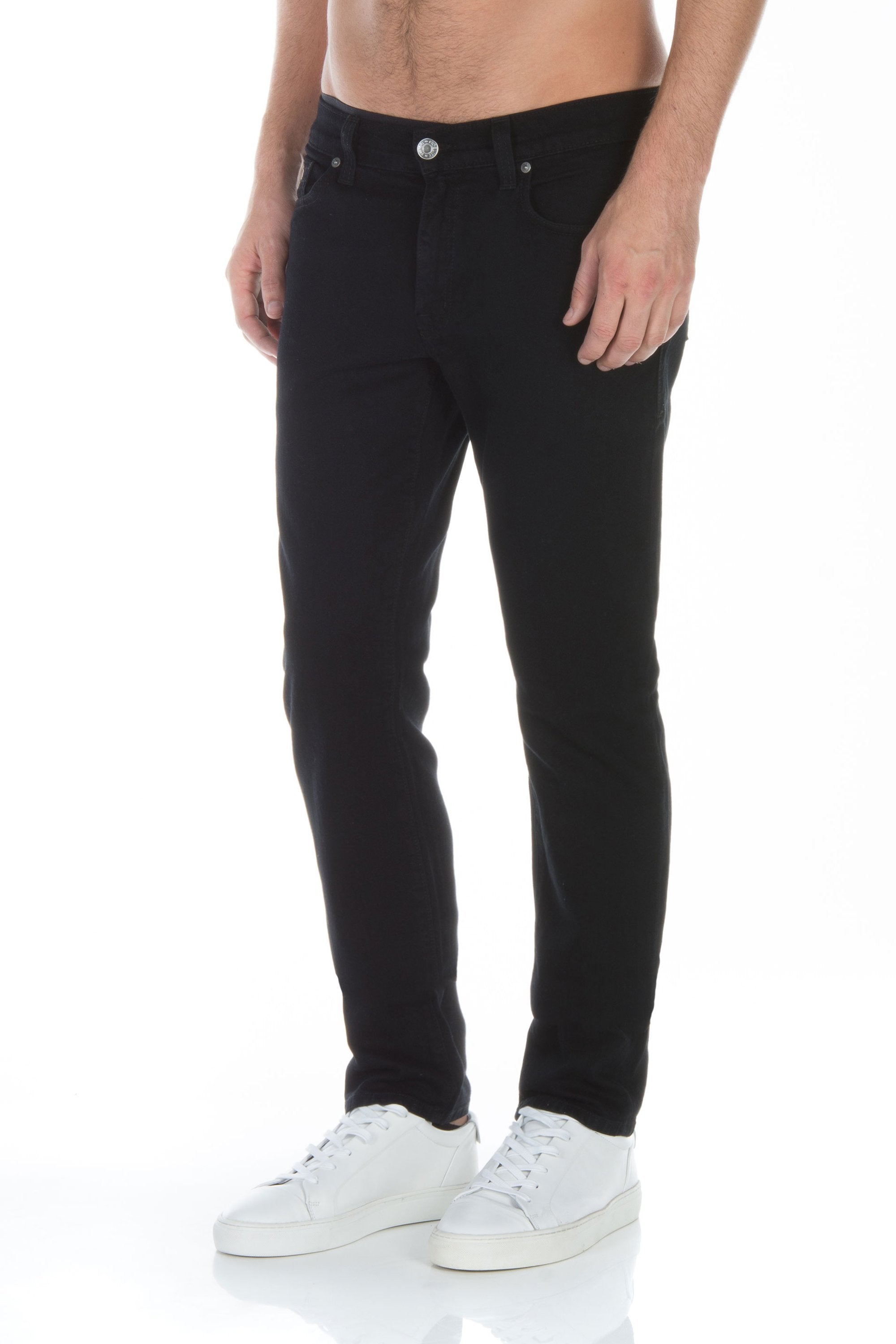 model wearing fidelity denim torino slim fit jean in gotham black, shown from the side