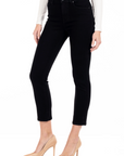 model wearing fidelity denim cher slim jean in noir black, shown from the side
