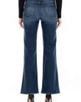 model wearing fidelity denim katie trouser fit in st tropez blue, shown from the rear