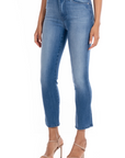model wearing fidelity denim cher slim jean in st martin blue, shown from the side