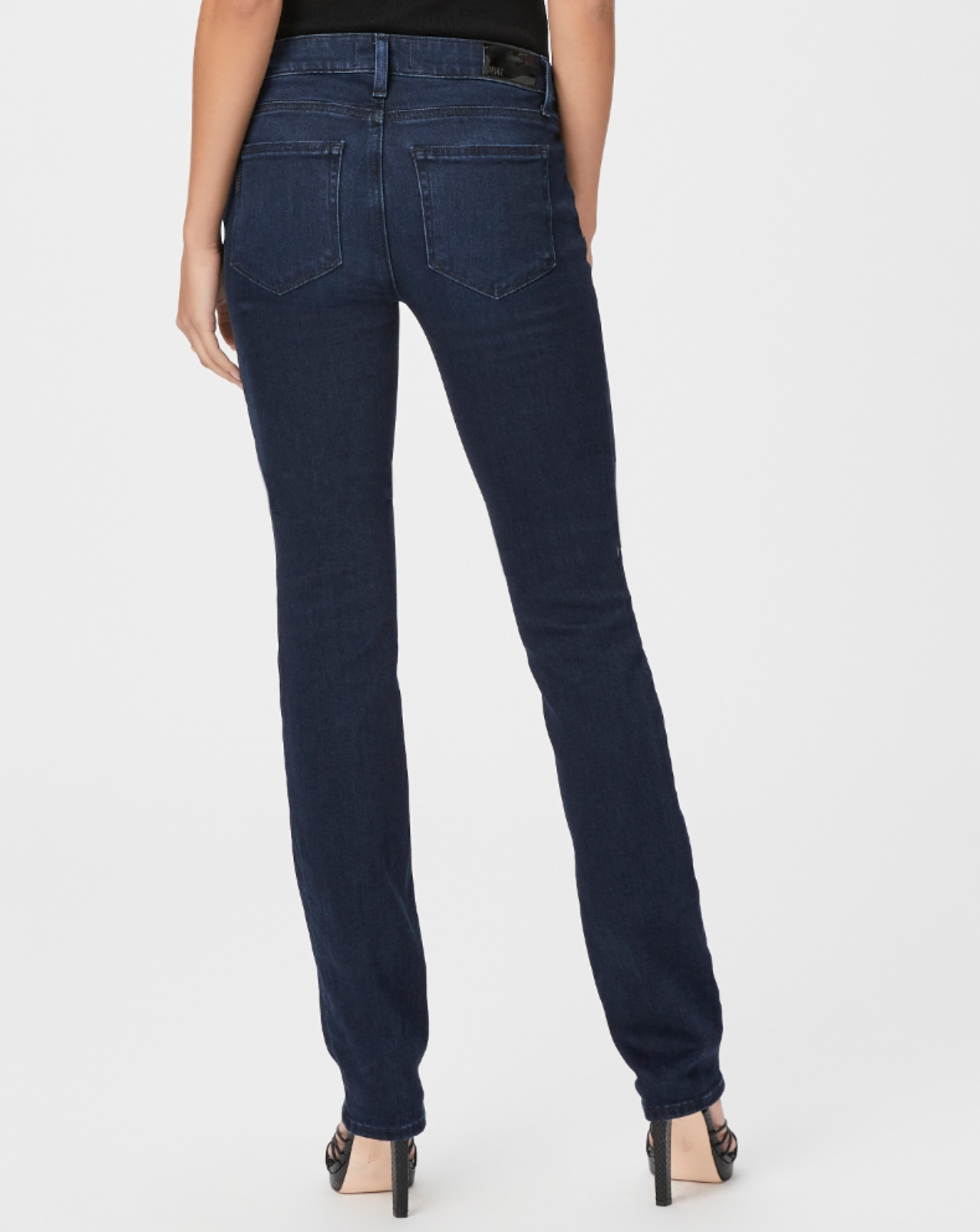 waist down rear view of the skyline mid rise straight jean from paige in manifesto dark blue