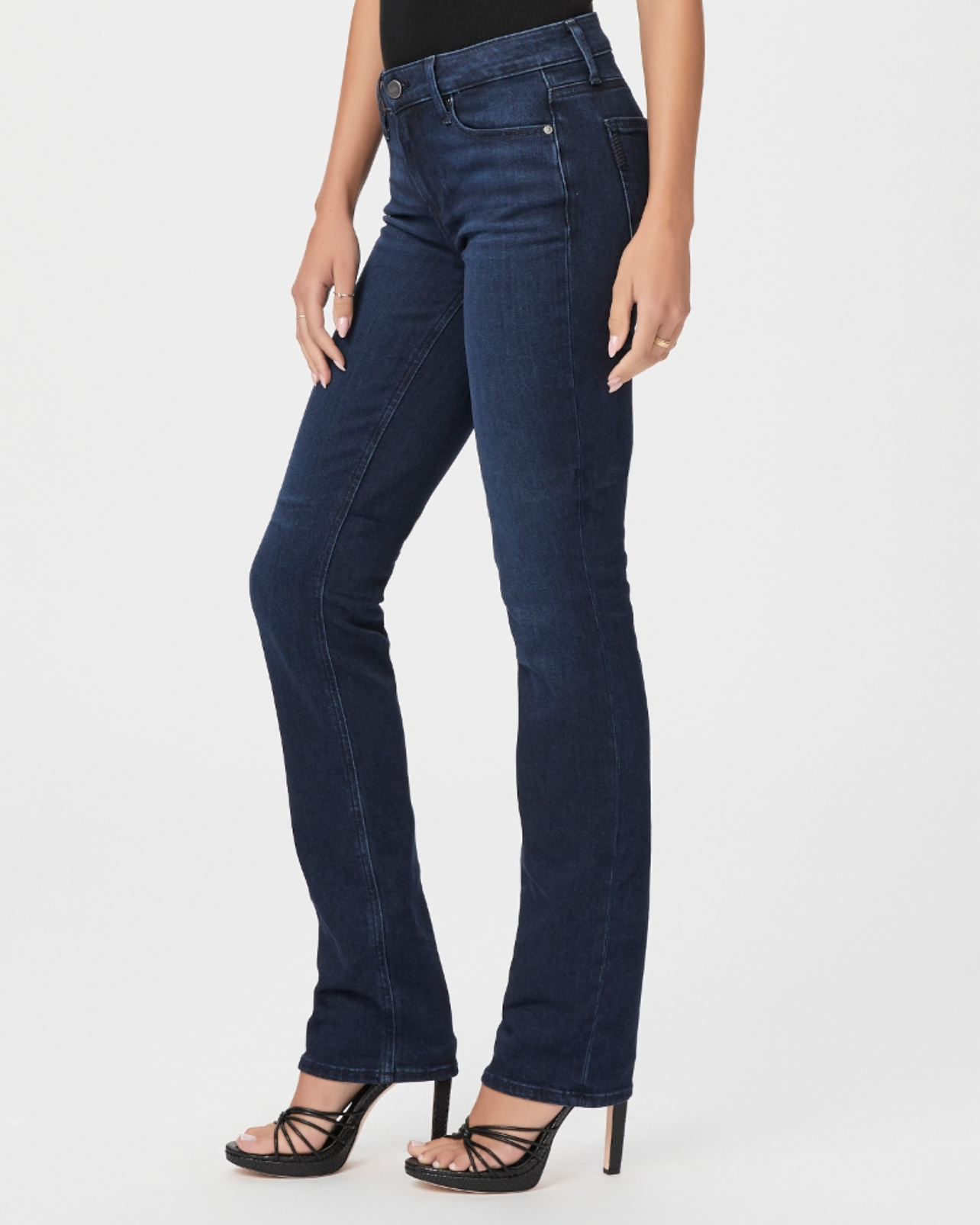waist down side view of the skyline mid rise straight jean from paige in manifesto dark blue