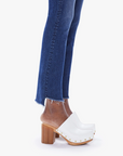 close up view of the hem of the insider crop step fray jean from Mother in teaming up blue