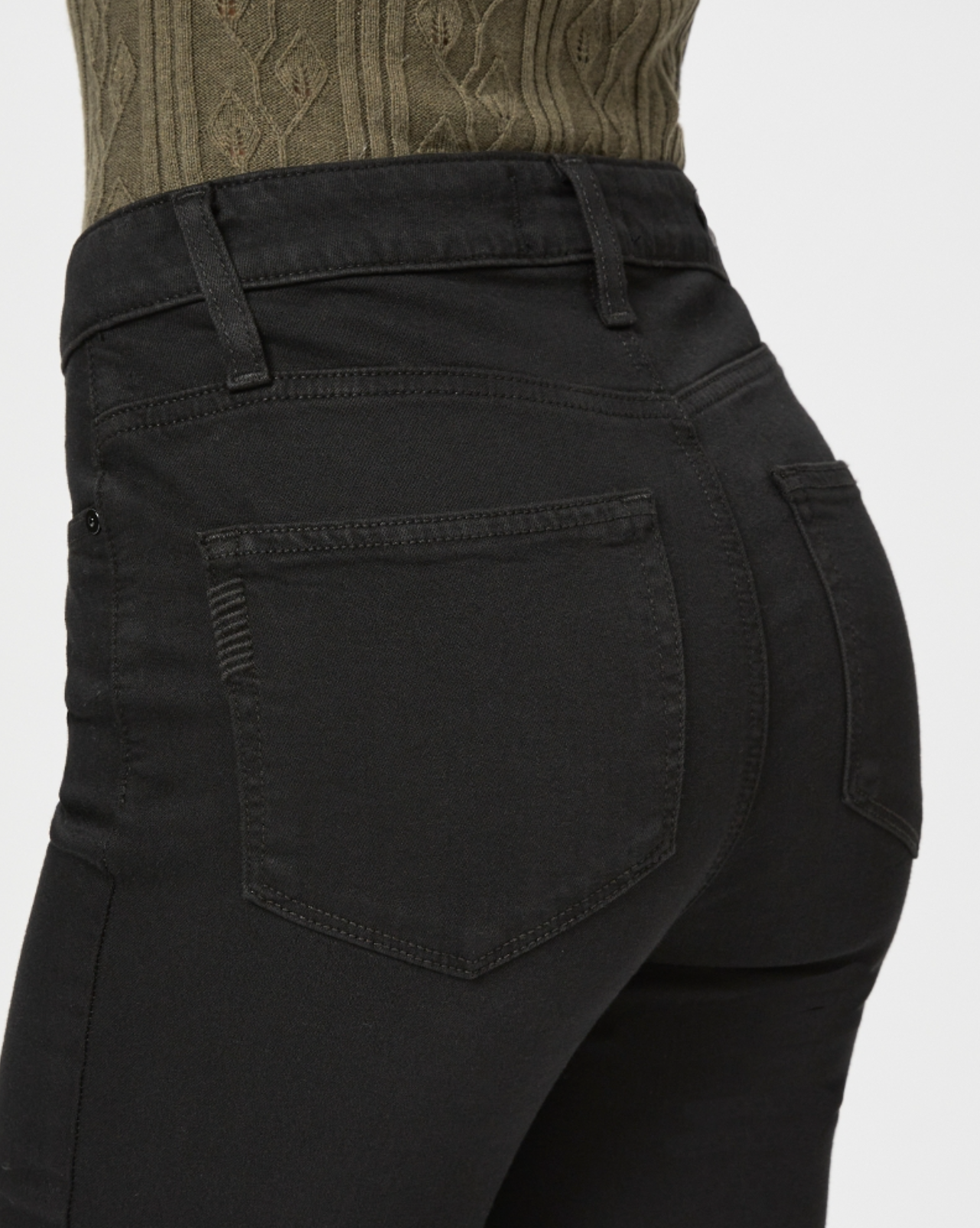detail rear view of the cindy jean with raw hem from paige, in black, showing pocket detail