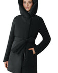 Black hooded coat worn by a woman on a white background