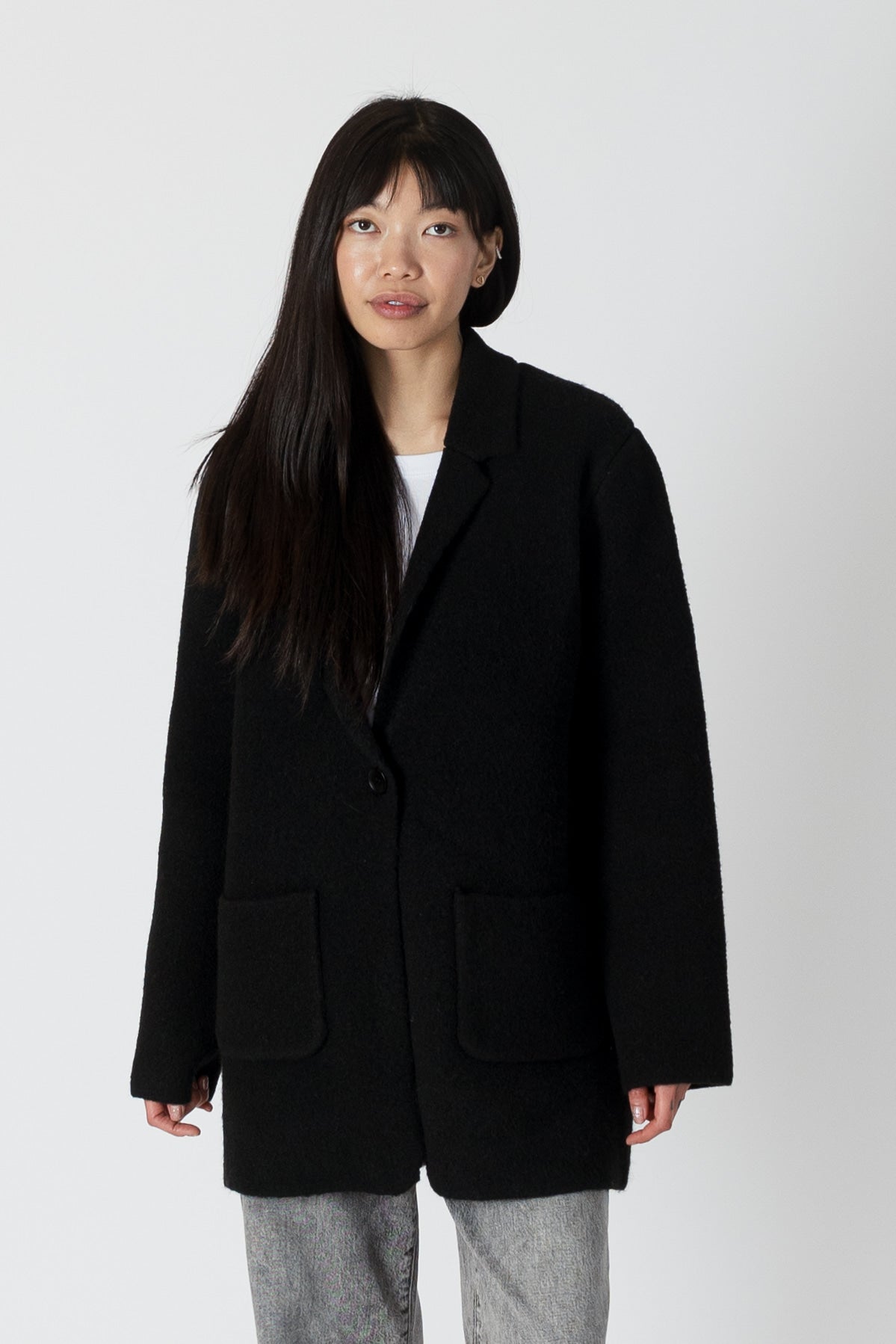 model wearing genie knit boyfriend blazer in black, buttoned