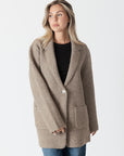 model wearing genie knit boyfriend blazer in beige, front view