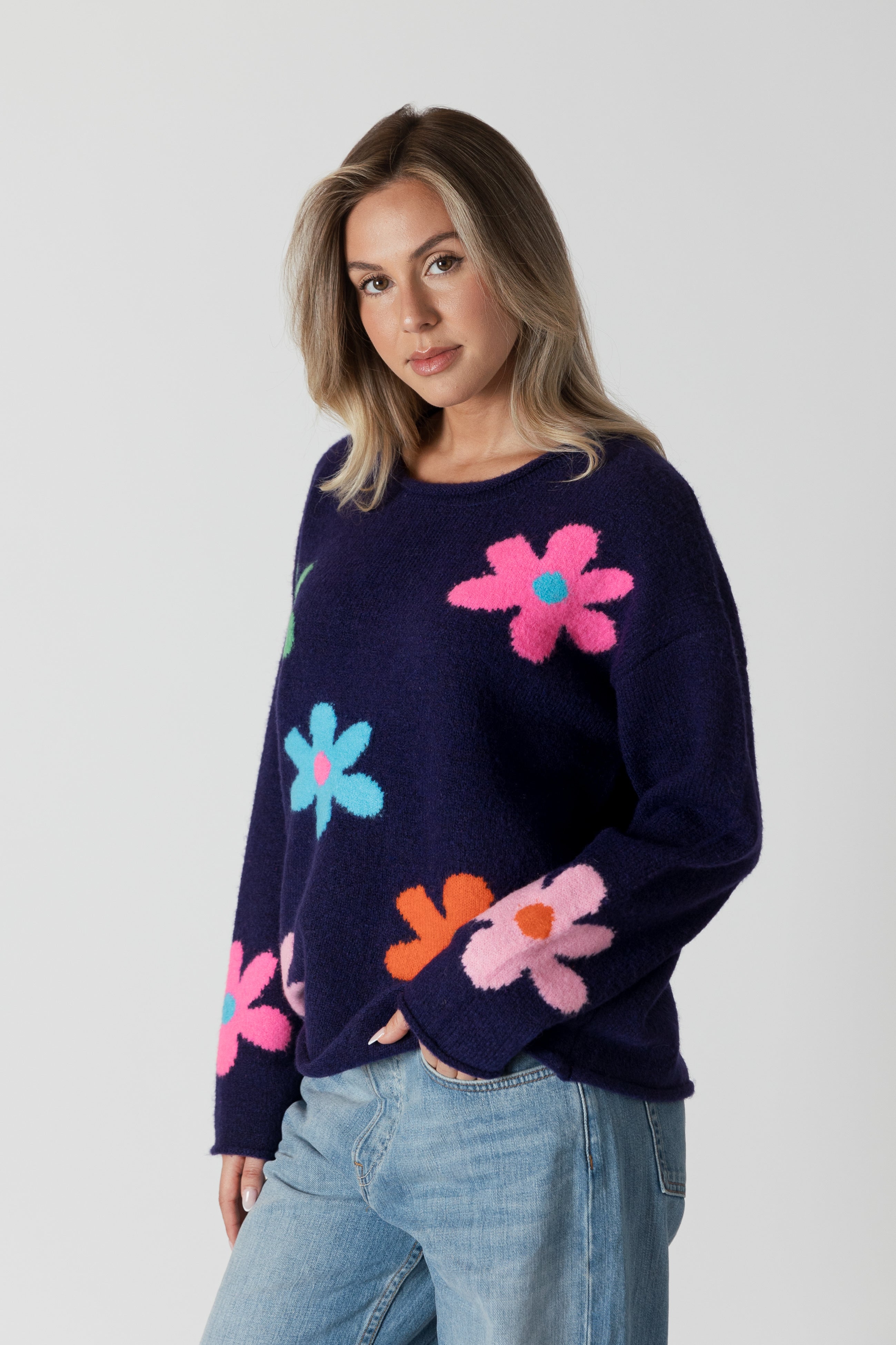 model wearing lyla & luxe jodi multicolour flower print sweater, angled view