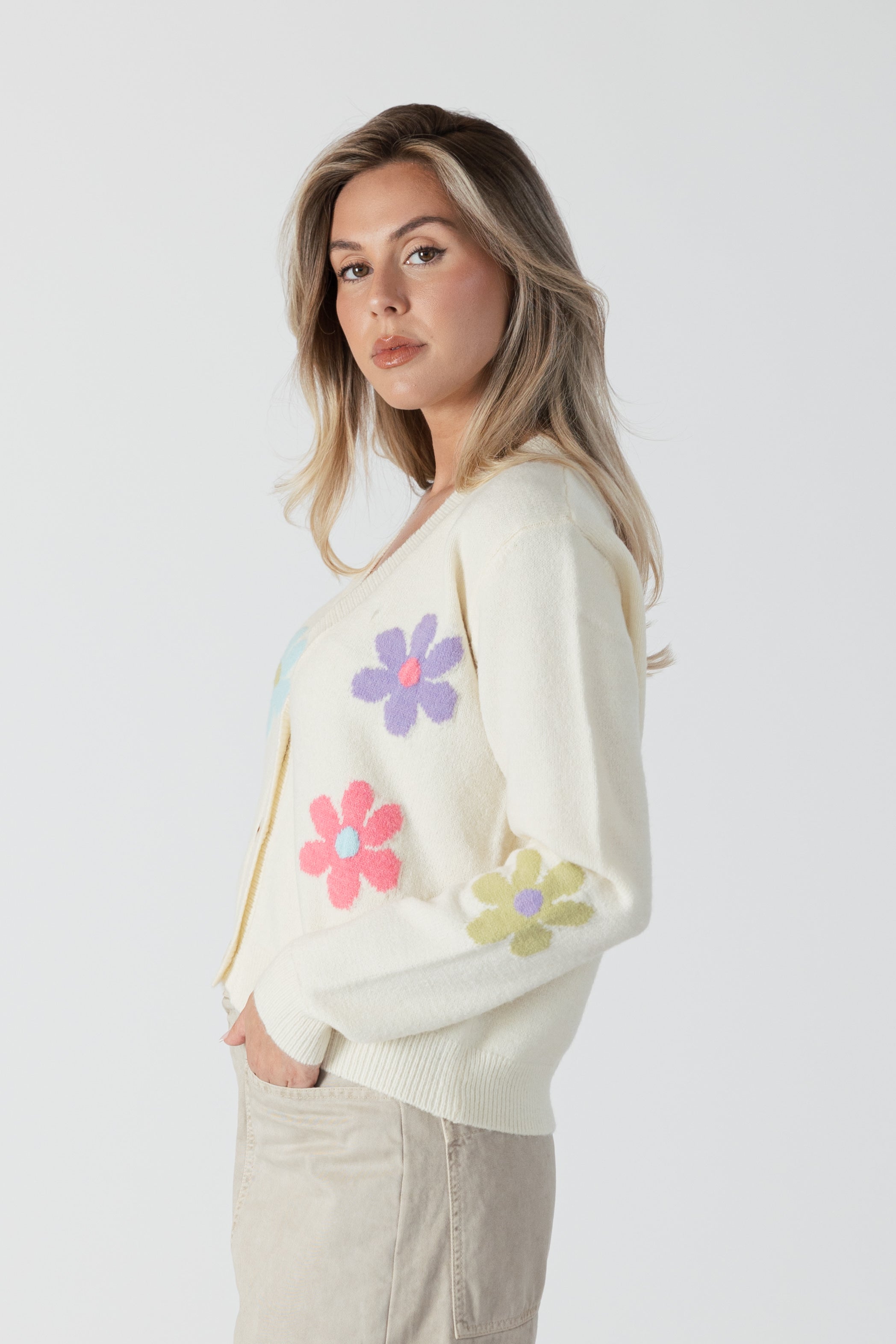 model wearing jolene button front floral print cardi from lyla & luxe, side view 