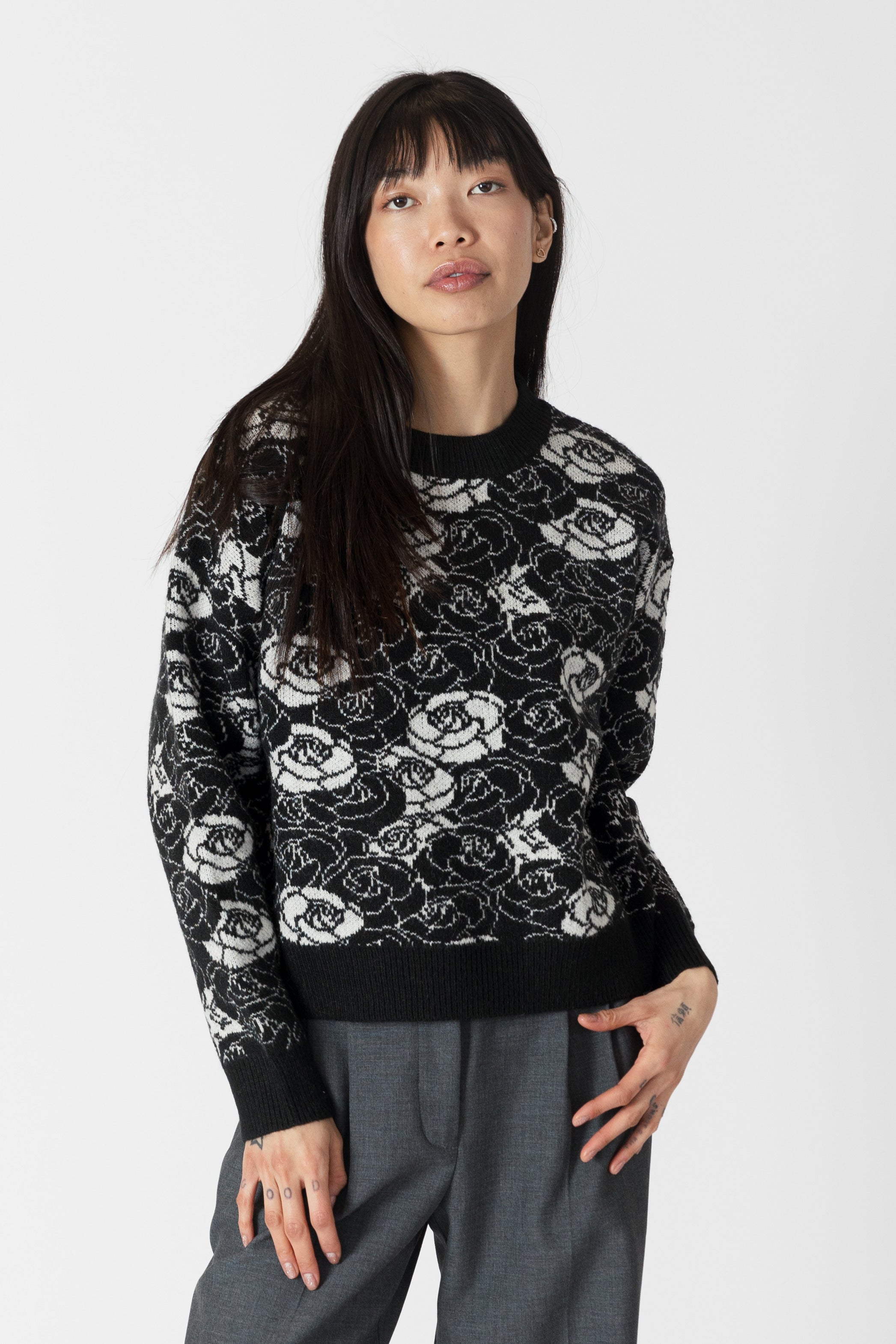 model wearing jordyn rose print crew neck sweater from lyla & luxe, front view