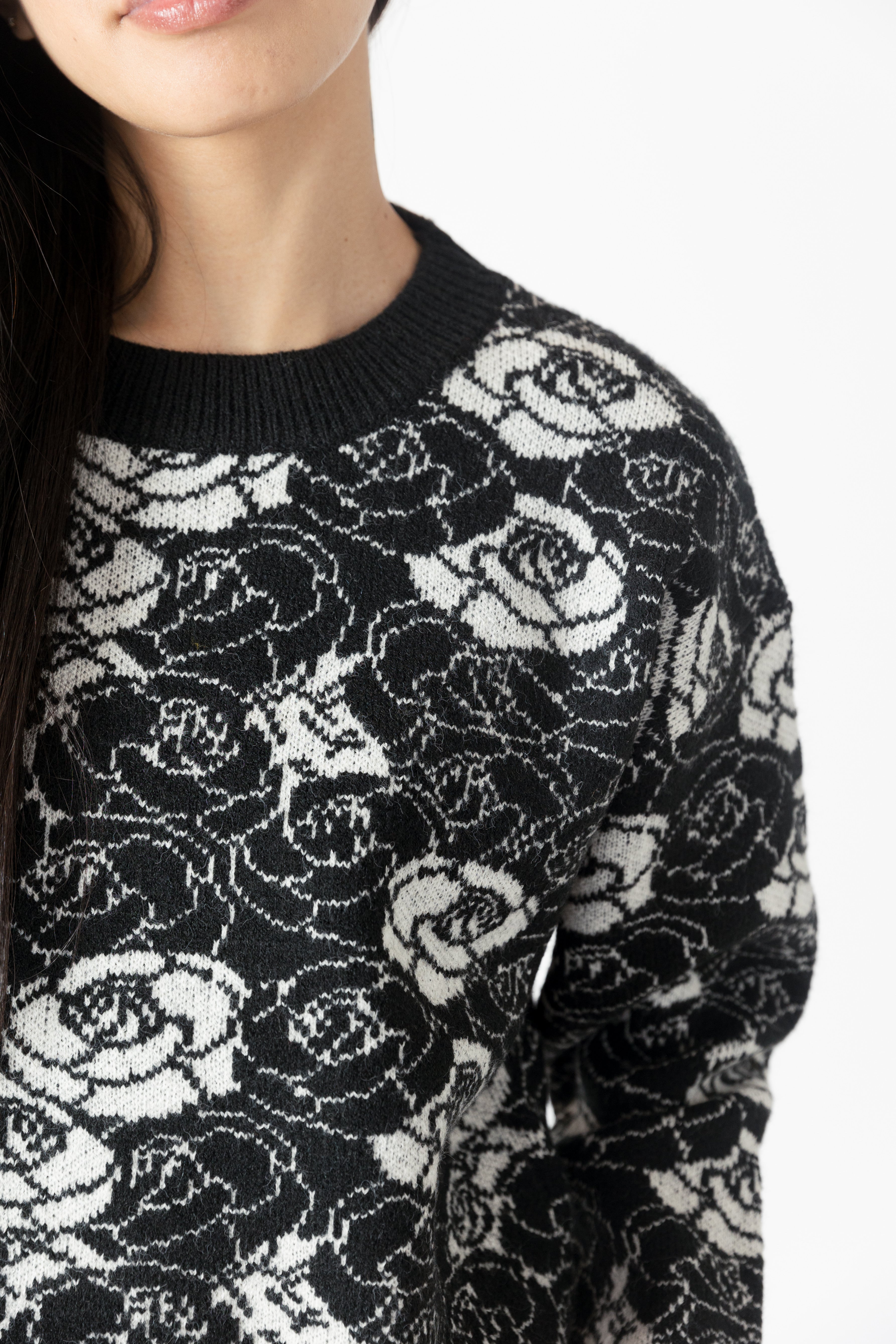 model wearing jordyn rose print crew neck sweater from lyla & luxe, detail view