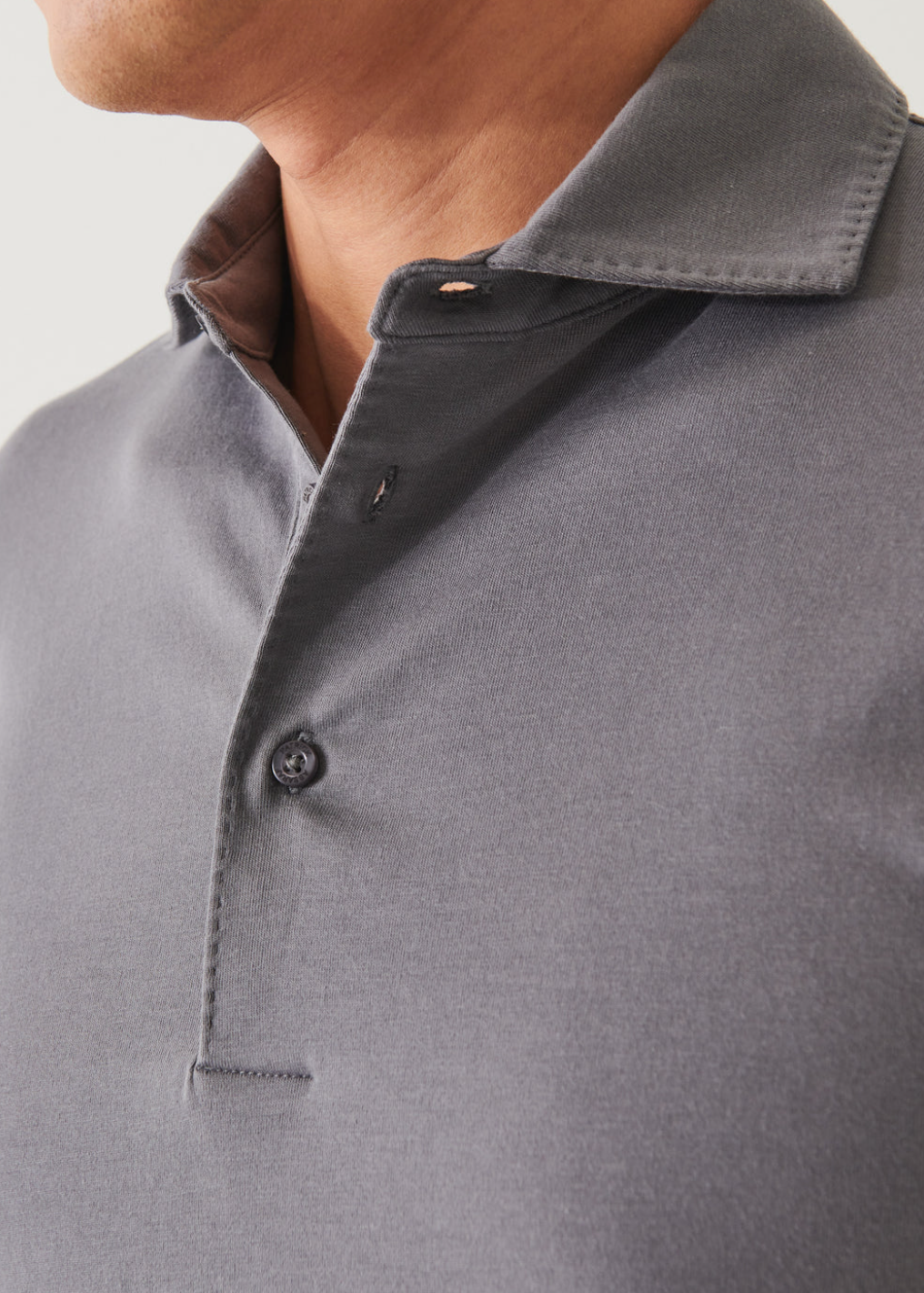 close up view of the long sleeve pima stretch polo shirt in light grey