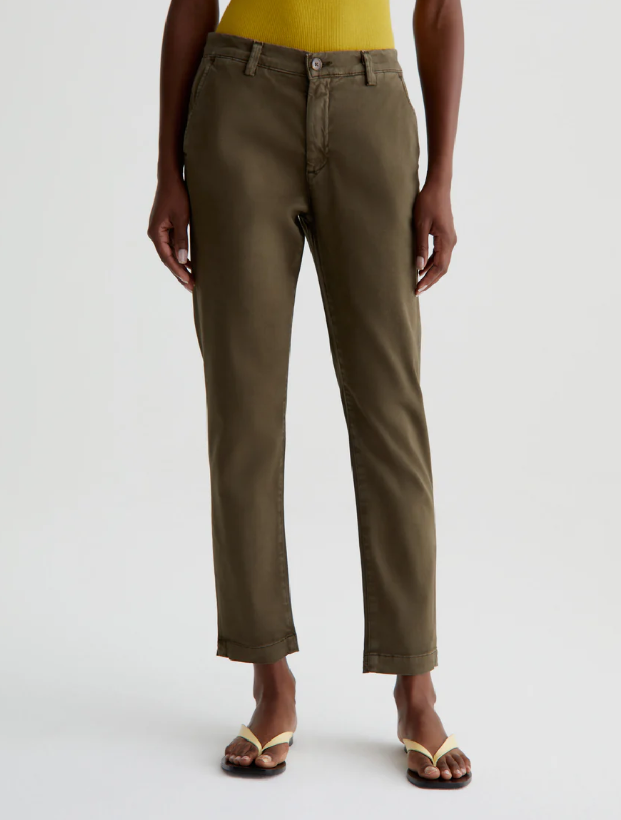 model wearing caden tailored trouser in sulfur shady moss green, shown from the waist down