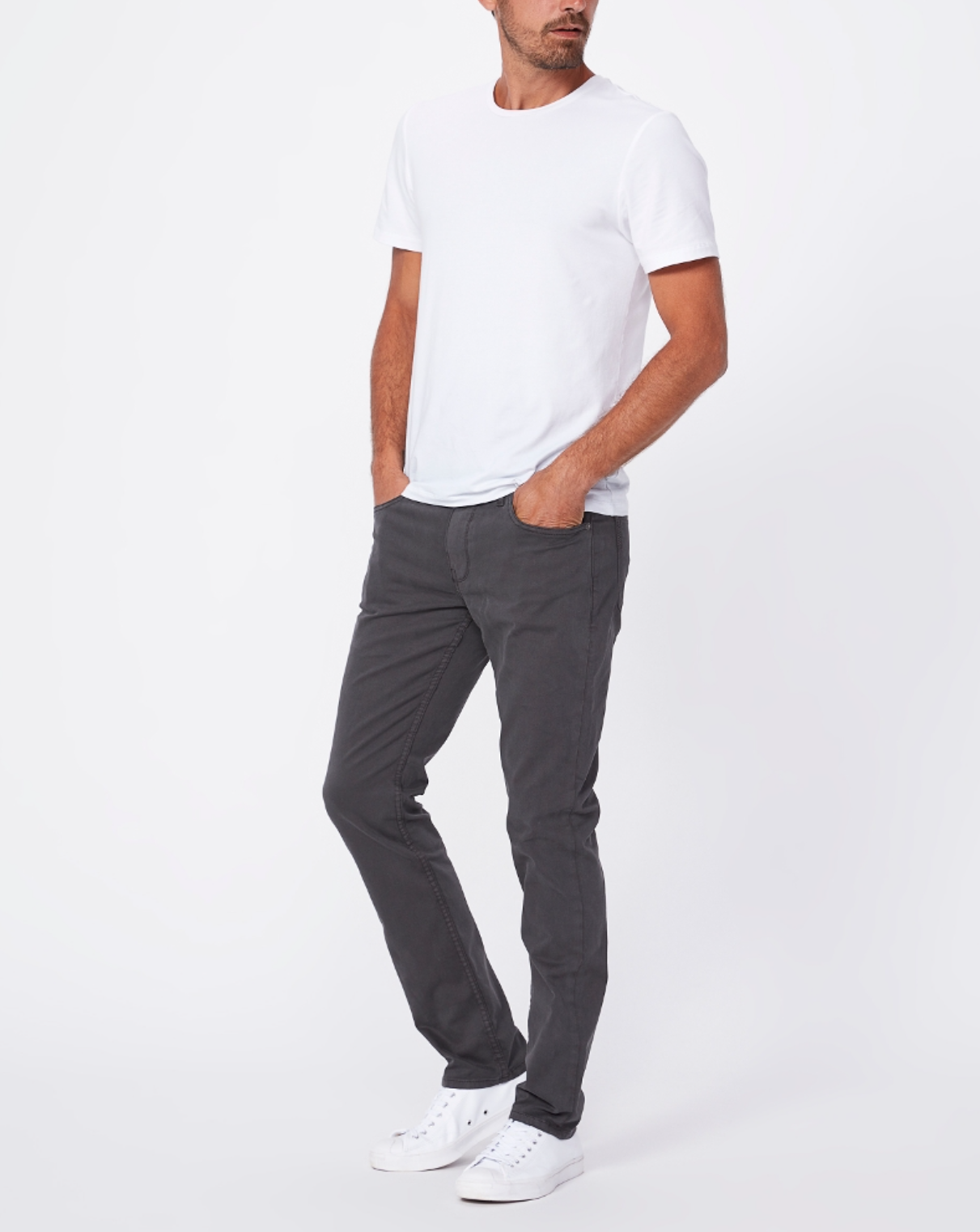 full body view of the lennox skinny fit twill pant from paige, in grey, styled with a white t-shirt